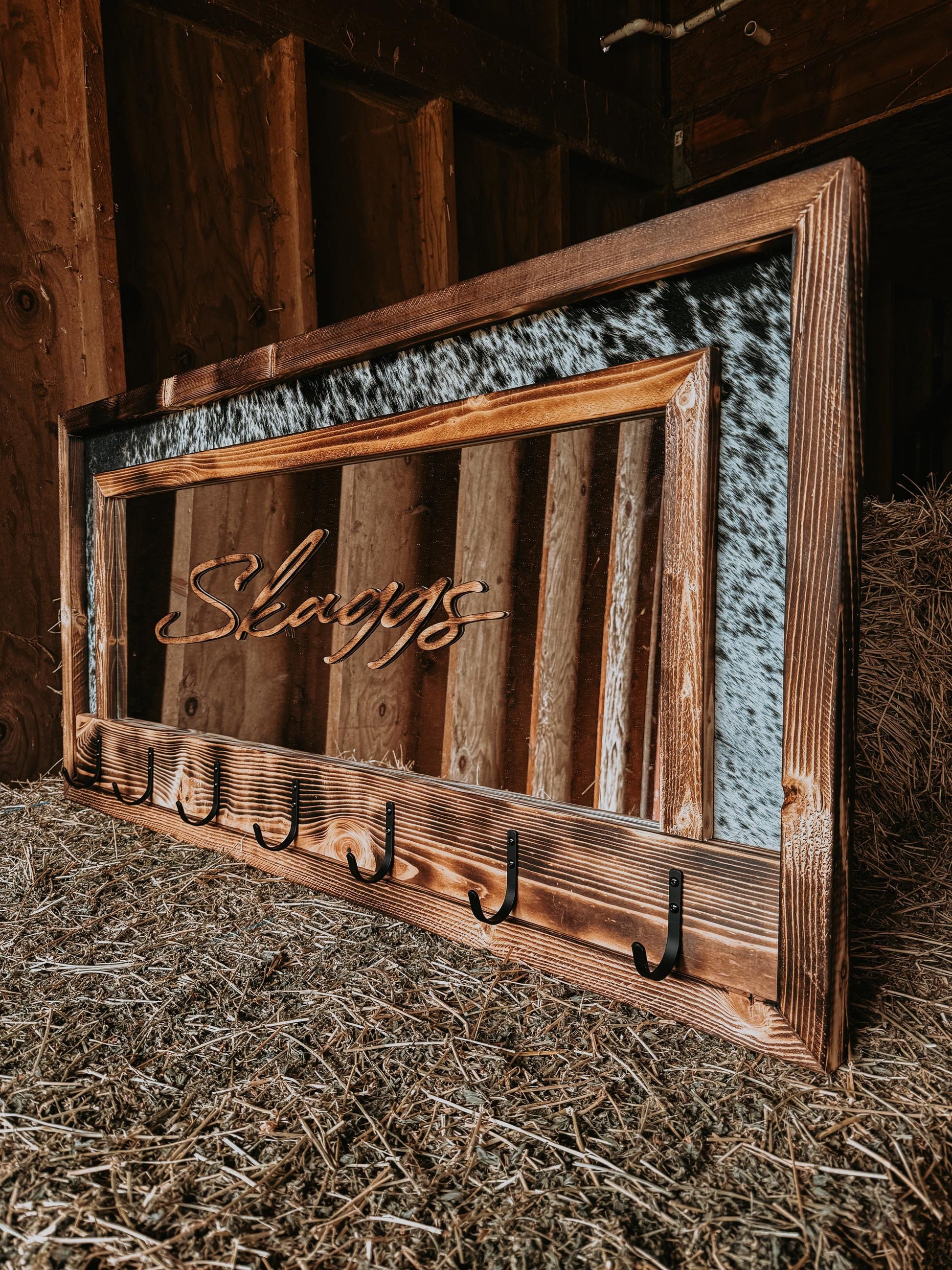 Cowhide framed mirror with hangers