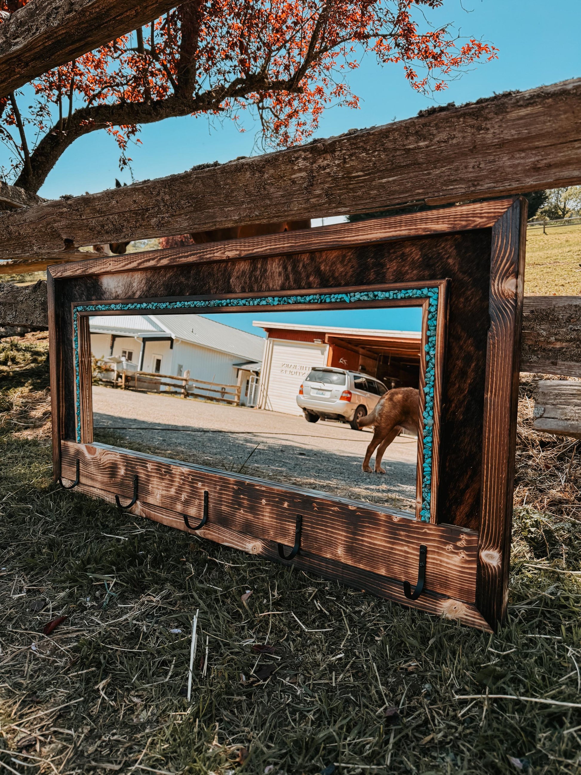 Cowhide framed mirror with hangers